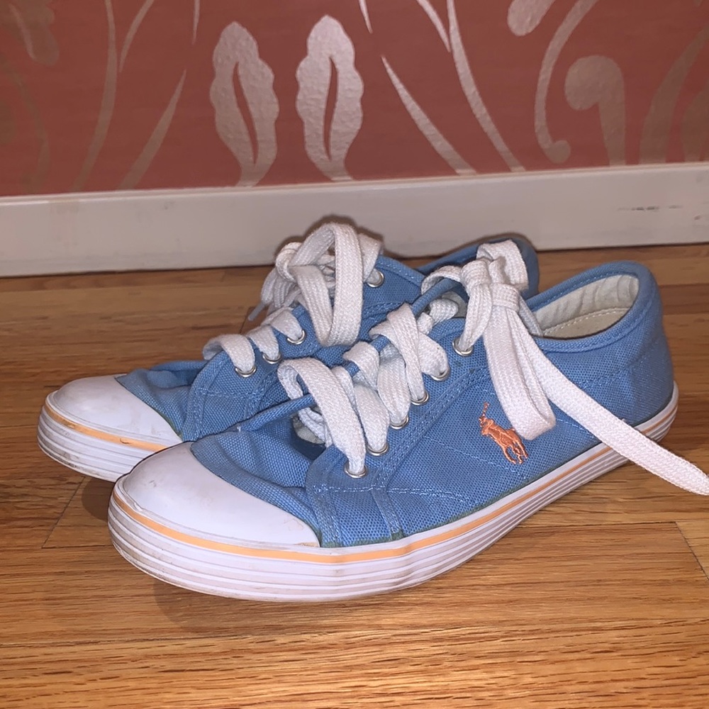 Light Blue Low-Top Fashion Sneakers. Orange Polo.